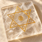 Close-up of the gold Shiv Shakti star engraving and natural veils in the sphatik plate